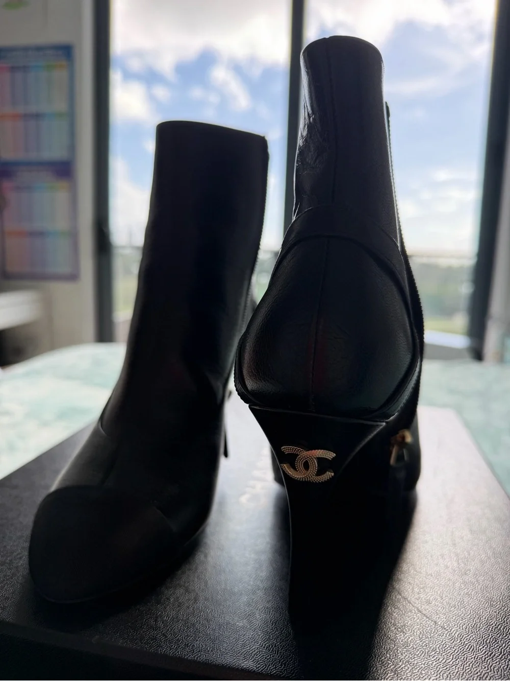 CHANEL Black Leather Ankle Booties with Black Cap Toe and Gold CC